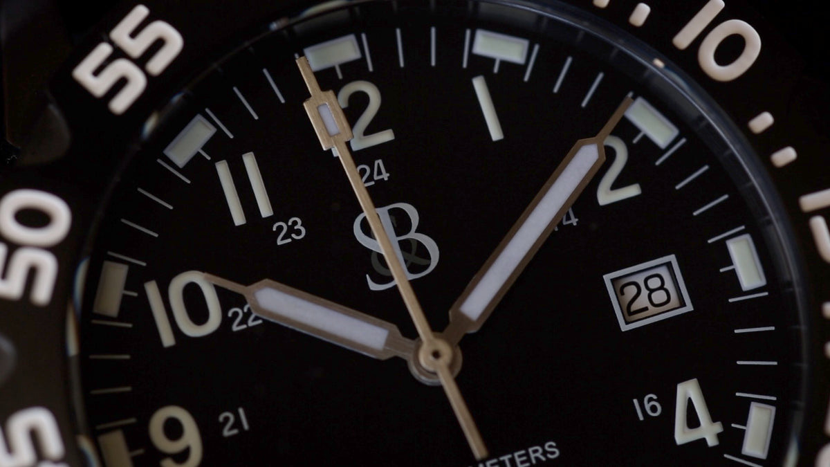 Black Tactical SANS-13 dial close-up with S&B monogram